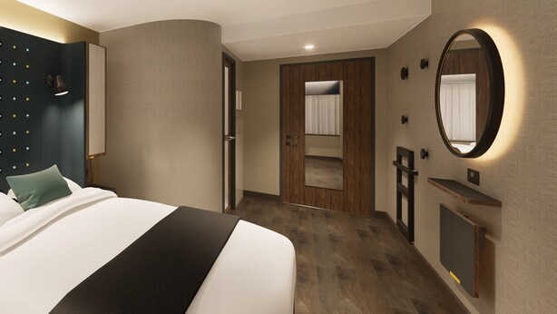 A modern hotel room with a large bed, a wooden door, a mirror, and a small desk. - Point A Hotel Edinburgh, St Andrew Square (Edinburgh)