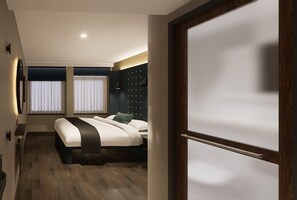 A modern hotel room with a bed, bedside tables, a wall-mounted light fixture, and a window with curtains. - Point A Hotel Edinburgh, St Andrew Square (Edinburgh)