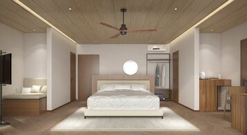 Un dormitorio moderno con una cama grande, un ventilador de techo, un armario y una mesita de noche.
