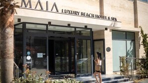 A luxury beach hotel with a modern entrance, glass doors, and a sign reading 'MAIA LUXURY BEACH HOTEL & SPA'. - Maia Beach Hotel (Aydın)