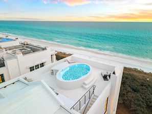 A rooftop with a swimming pool, a beach view, and a clear sky. - Alys Beach Gulf-Front Estate • Rooftop Pool, Outdoor Kitchen, Private Beach (Alys Beach)