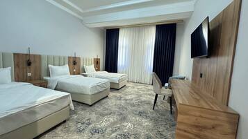 Triple Room, City View | Desk, laptop workspace, blackout curtains, soundproofing