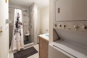 Shower, hair dryer, towels, soap
