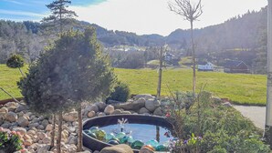 A garden with a pond, rocks, and trees. - 5 bedroom nice home in Konsmo (Konsmo)