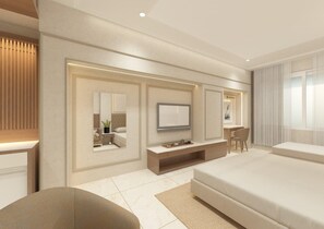 A modern hotel room with a large bed, a TV, a desk, and a seating area. - ANANTA KASHI HOTEL (Varanasi)