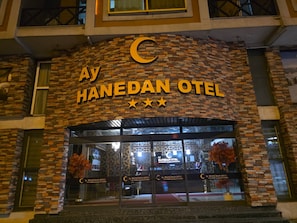 The exterior of Ay Hanedan Hotel with a stone facade and a prominent 'C' logo above the entrance. - AY HANEDAN HOTEL (Osmangazi /bursa)