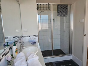 Shower, hair dryer, towels, soap