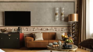 Junior Suite with Balcony Courtyard View | Living room | 65-inch Smart TV with cable channels