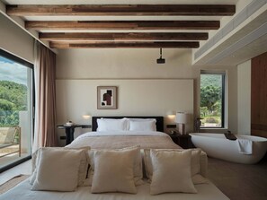 Grand Double Room, Sea View | Minibar, individually decorated, individually furnished, desk