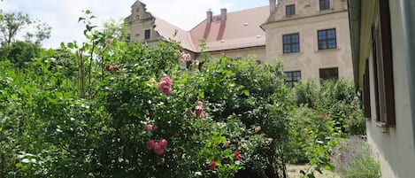 A building with a traditional architectural style, featuring a symmetrical facade with evenly spaced windows and a central entrance.