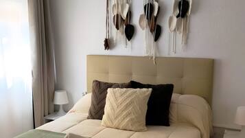 2 dormitorios, tabla de planchar con plancha, wifi y ropa de cama