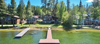 Lakefront McCall retreat with 6 bedrooms, 3 baths, hot tub, dock, and views.