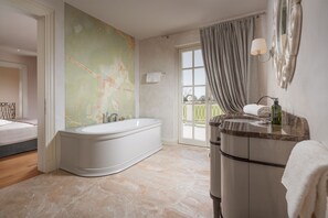 A modern bathroom with a freestanding bathtub, a vanity with a mirror, and a large window with curtains. - Villa Lea-casa del Sole Zadarvillas (Tar-Vabriga)