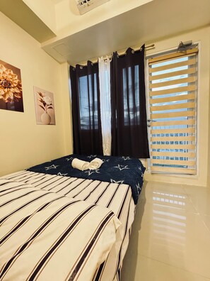 Free WiFi, bed sheets, wheelchair access - Grass Residence Cozy 1-bedroom condo with AC in awesome Quezon City (Quezon City)