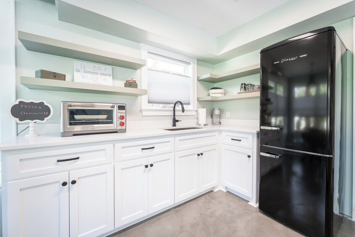 Fridge, toaster, cookware/dishes/utensils, dining tables