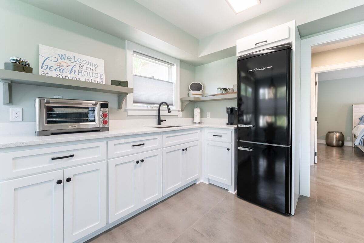 Fridge, toaster, cookware/dishes/utensils, dining tables