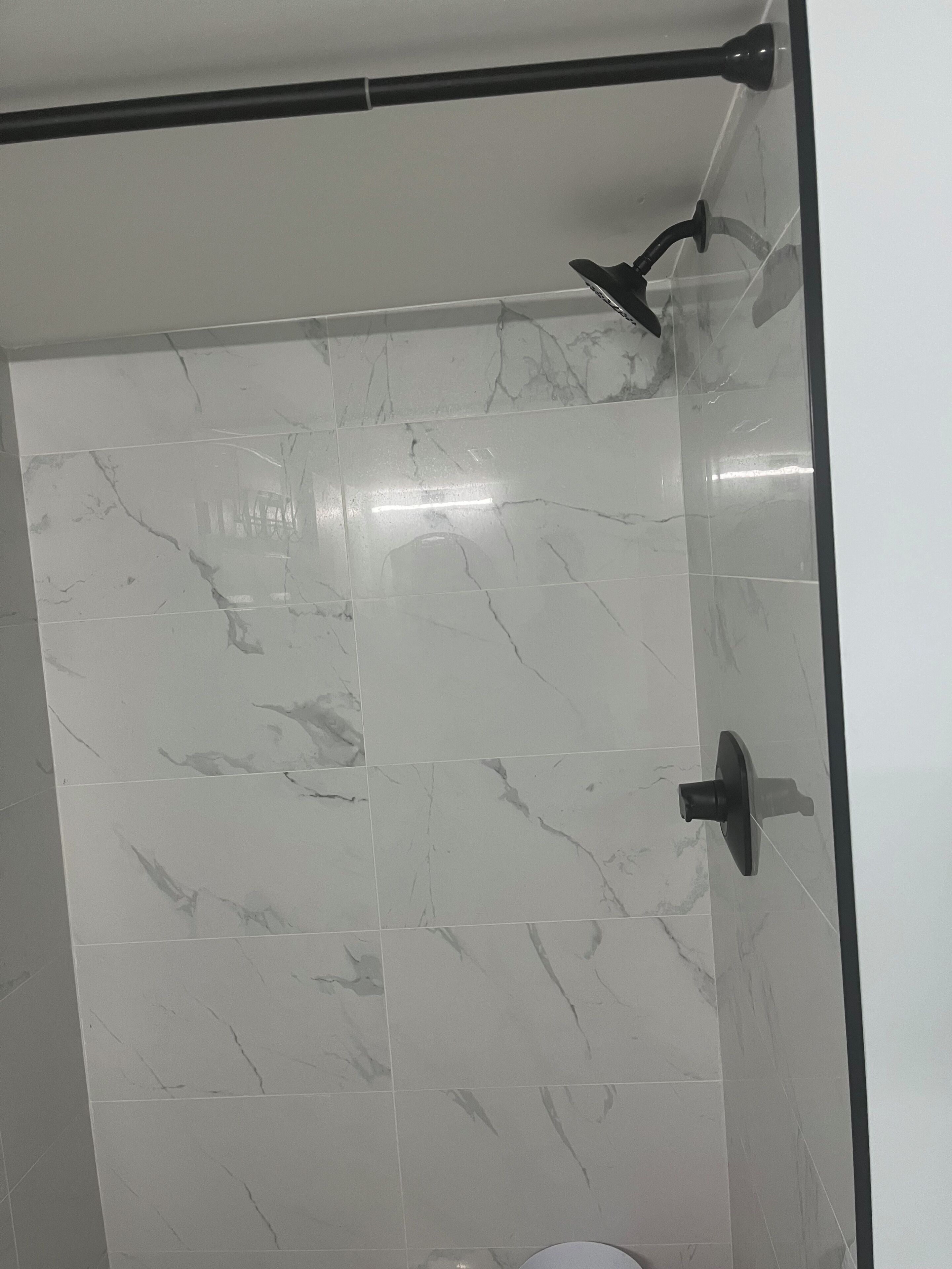 Shower, hair dryer, soap, toilet paper