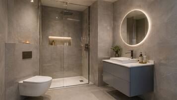 Deluxe Studio, 1 King Bed, City View | Bathroom | Hair dryer, towels, soap, shampoo