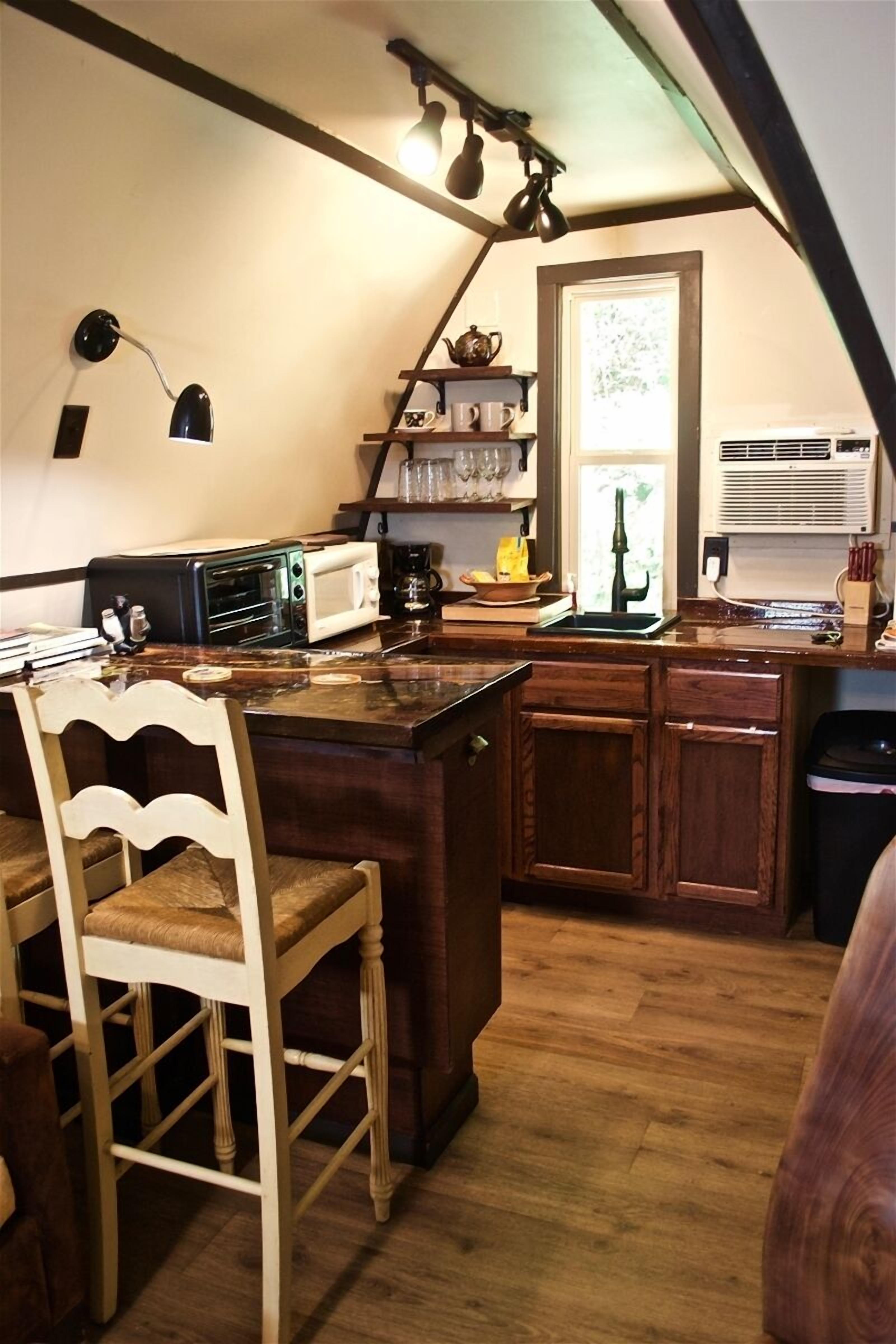 Fridge, microwave, coffee/tea maker, cookware/dishes/utensils