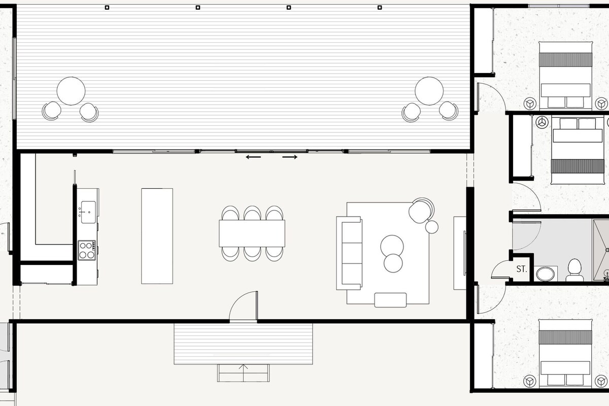A hotel layout with a central dining area, separate bedrooms, a kitchen, and a bathroom.