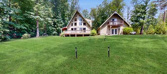 Lakefront property with beach, dock, game tables, guest house, grill, W/D, & AC