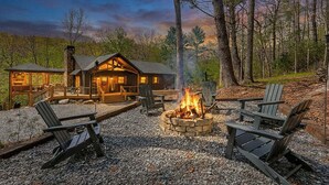 A cabin with a fire pit, outdoor seating, and a deck. - Creekside Solace by Mountain Oasis | Near Aska Adventure Area w/Toccoa River Access (Blue Ridge)