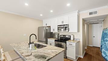 Coffee/tea maker, fridge, microwave, oven
