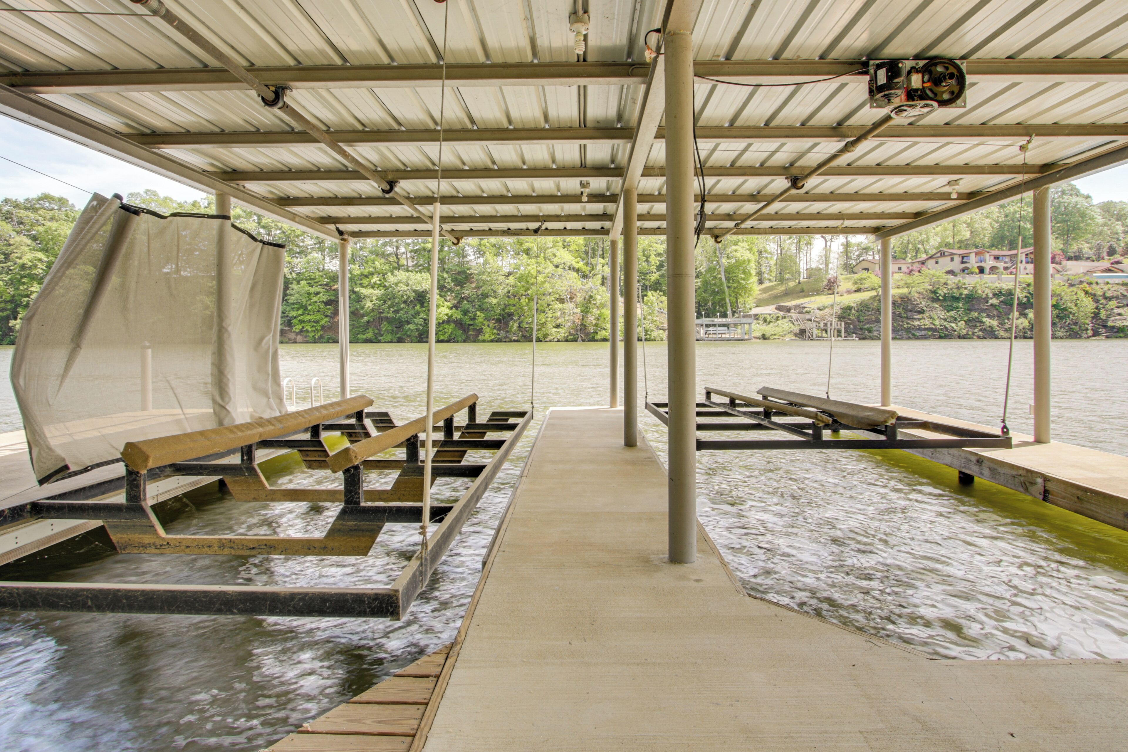 A covered dock area with benches and a camera mounted on the ceiling.