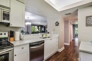 Fridge, microwave, oven, stovetop - Spacious, air-conditioned condo with private W/D, beach shuttle, & central AC (Bonita Springs)