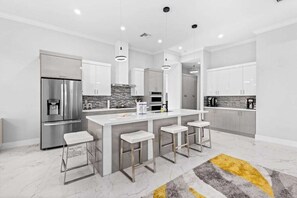 Fridge, microwave, oven, stovetop - Luxe brand-new home with designer interior, lanai, private pool, & spa (Bonita Springs)