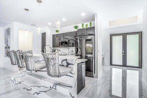 Fridge, microwave, oven, stovetop - Dog-friendly home with outdoor kitchen, game room, cabana, pool spa & pool (Cape Coral)