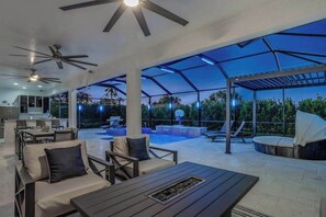 Outdoor dining - Dog-friendly home with outdoor kitchen, game room, cabana, pool spa & pool (Cape Coral)