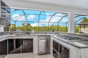 Fridge, microwave, oven, stovetop - Dog-friendly home with outdoor kitchen, game room, cabana, pool spa & pool (Cape Coral)