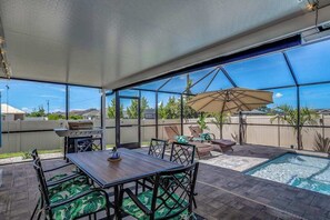 Outdoor dining - Private home with heated pool, screened lanai, grill, sun deck, & yard games (Cape Coral)