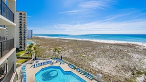 A resort with a pool, beach view, and high-rise buildings. - Phoenix Vi 6607 1 Bedroom Condo (Orange Beach)