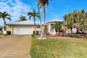 Exterior - Waterfront home with private pool, lanai, dock, & tiki hut (Cape Coral)