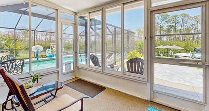 Outdoor paradise on waterway with pool and spa, beach gear, and dog friendly