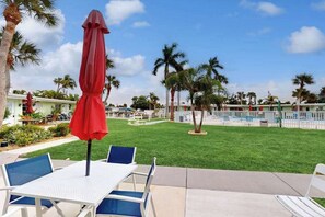 Outdoor dining - Canal-front condo with private docks, heated pool, private beach access, BBQ (Englewood)