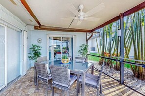 Outdoor dining - Dog-friendly tropical home on the canal w/ screened patio w/ pool & private dock (Cape Coral)
