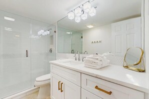 Shower, hair dryer, towels - A Fully Remodeled Gulf Retreat — Stylish Comforts Steps from the Shore. (Bonita Springs)