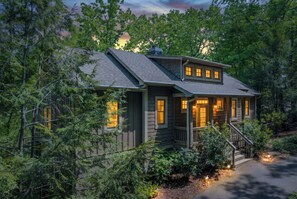 A house with a porch, a covered entryway, and a staircase leading to the front door. - Lake Escape - Dawsonville,GA (Jasper)