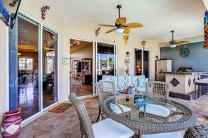 Outdoor dining - Dog-friendly home on canal with heated pool, spas, central AC, & washer/dryer (Cape Coral)