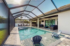 Pool - Modern canal-front luxury with pool, patio, grill, dock, Ping-Pong, AC, & WiFi (Cape Coral)
