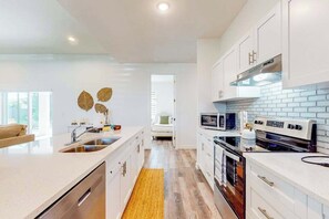 Fridge, microwave, oven, stovetop - Dog-friendly coastal home w/ private pool, WiFi, W/D, & bikes (Cape Coral)