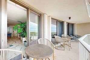 Outdoor dining - Gulf front condo with heated pool, tennis court, and fitness center (Marco Island)