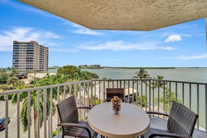 Outdoor dining - Oceanfront condo with pool, hot tub, beach access, & washer/dryer (Bonita Springs)