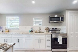 Fridge, microwave, oven, stovetop - Canal front apartment with waterfront views, private patio, and yard (Bonita Springs)