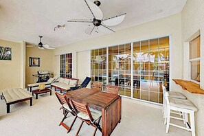 Outdoor dining - Dog-friendly canal-front home with a private pool & dock in a prime location (Cape Coral)