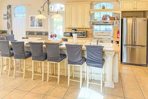 Fridge, microwave, oven, stovetop - Villa Euphoria: Chic 2-unit, canal-front retreat with 2 pools & private dock (Cape Coral)