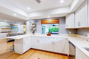 Fridge, microwave, oven, stovetop - Chic pool home w/ designer, heated, saltwater pool,attached spa, covered patio (Cape Coral)